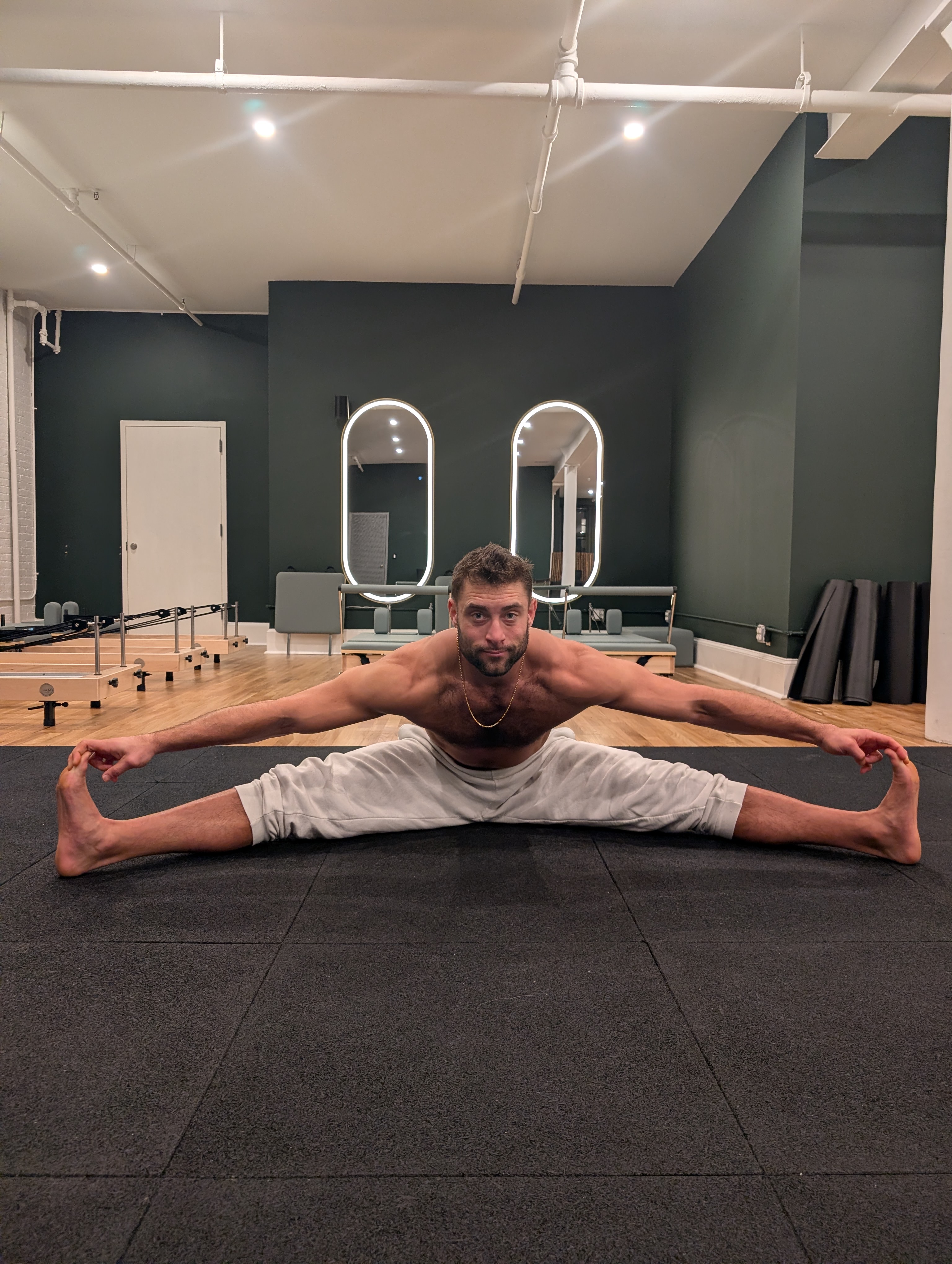 Robby in seated wide-leg forward fold